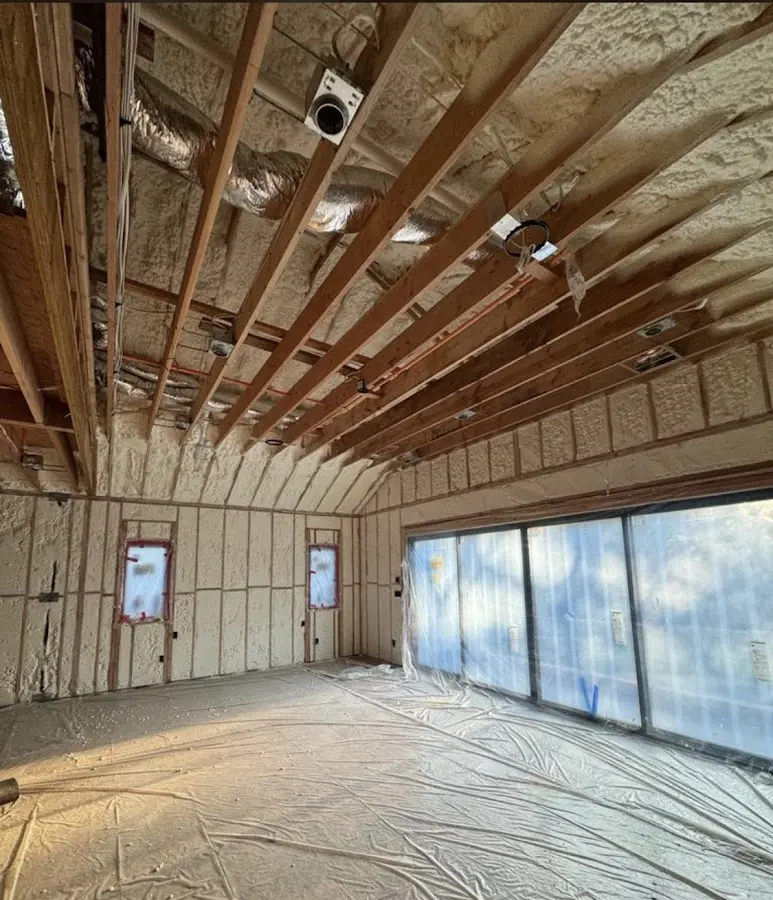 Interior walls and ceiling insulated with spray foam during new construction in Palm Bay